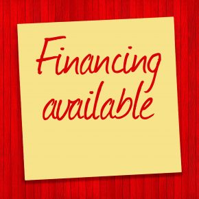 Financing Available text on yellow sticky note and red background